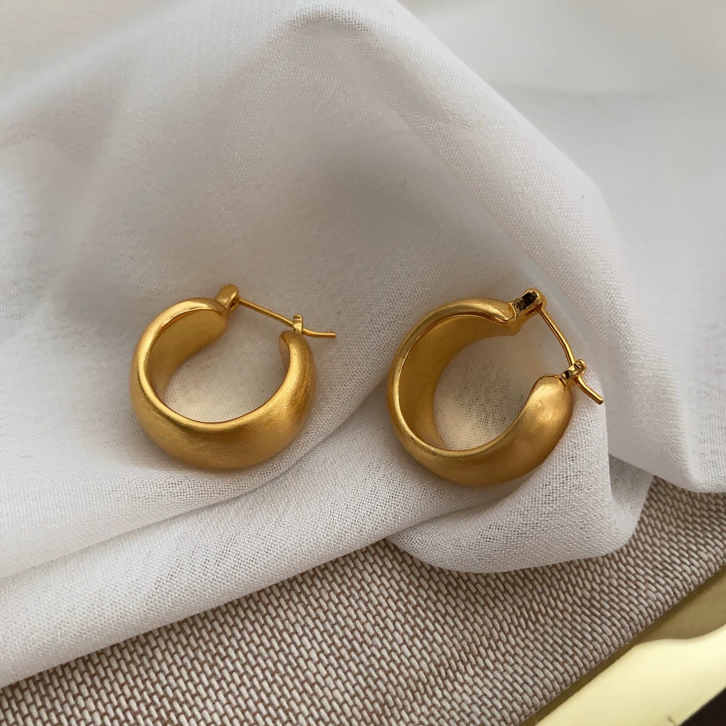 Hand brushed frosted ear loops