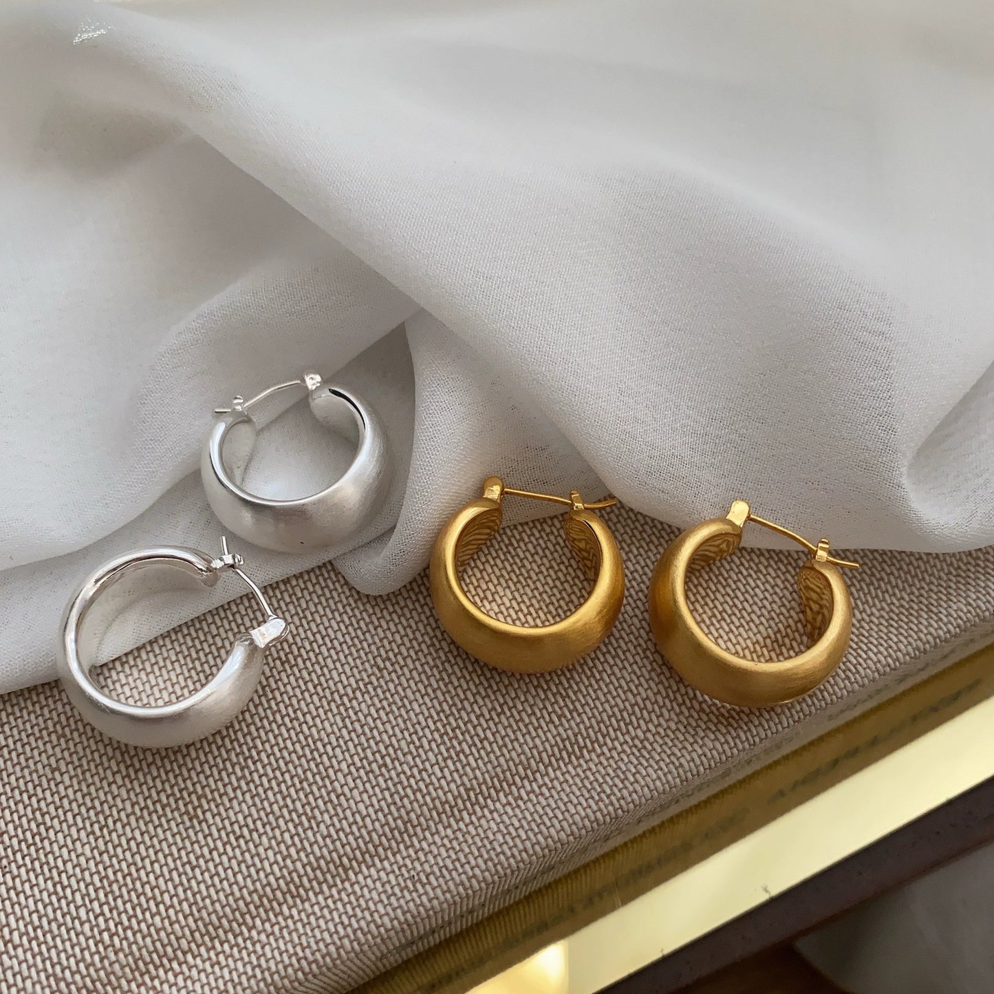 Hand brushed frosted ear loops