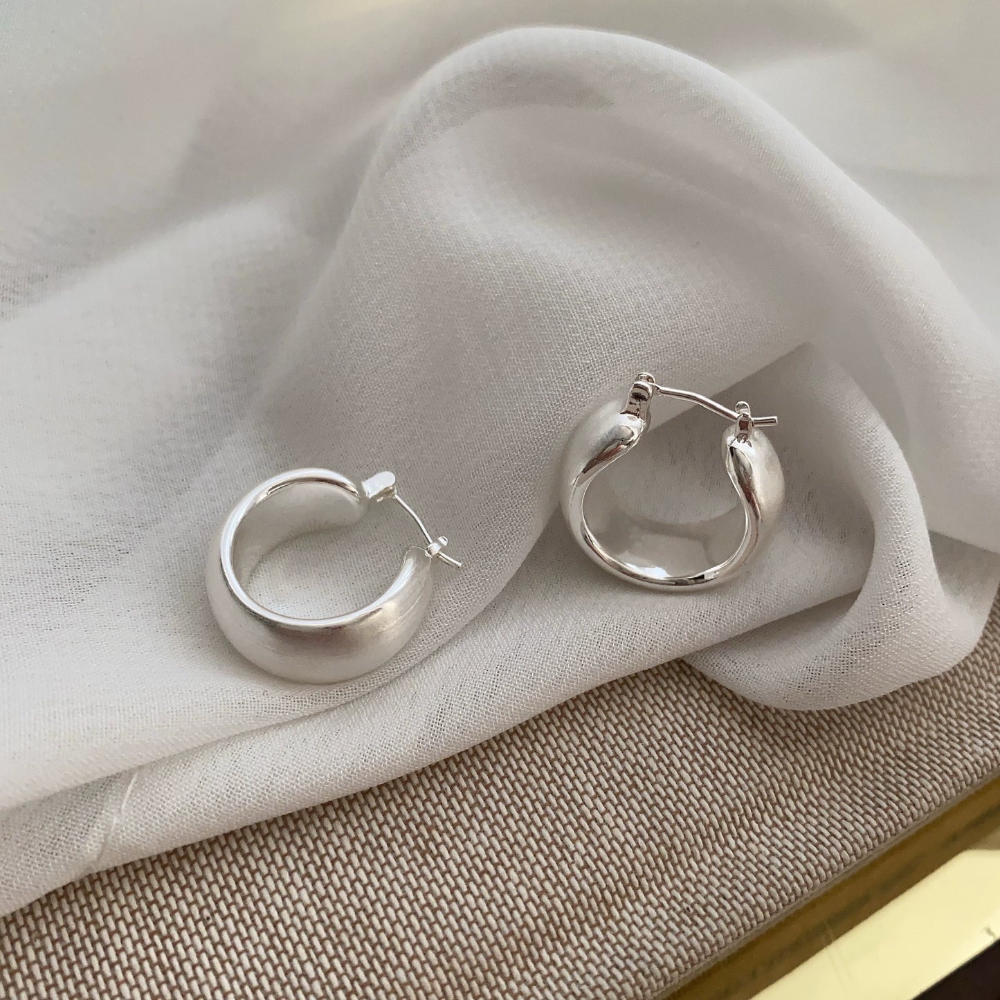 Hand brushed frosted ear loops